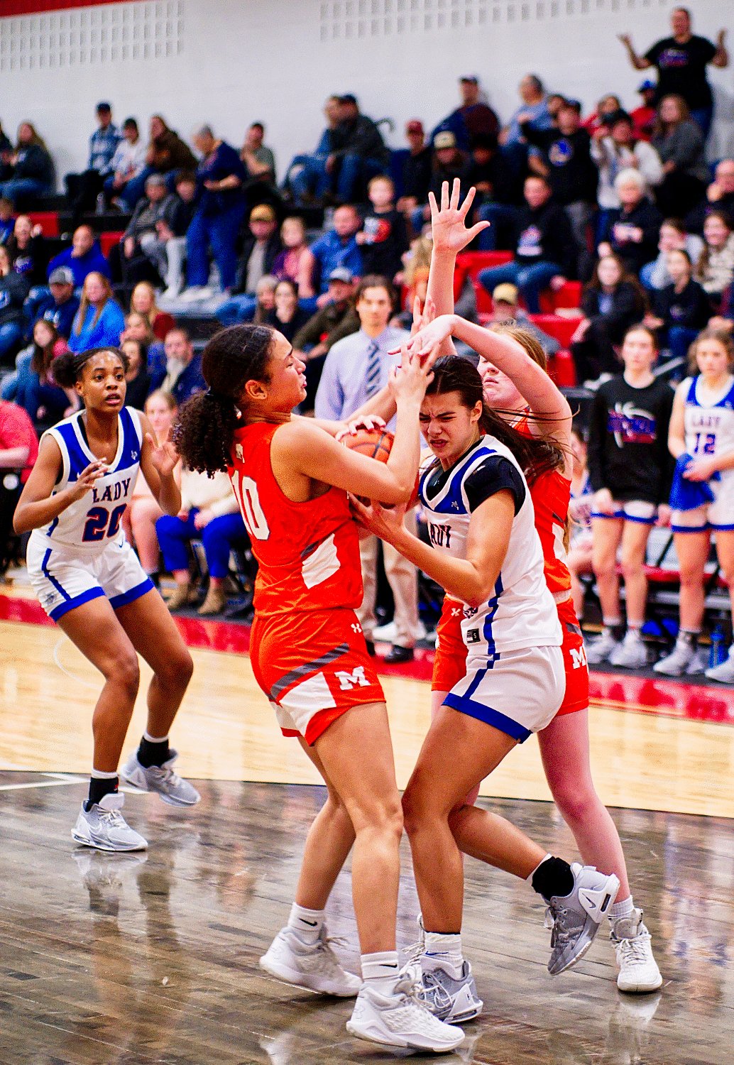 Lady Jacket teammates Jayla Jackson and Macy Fischer swarm Sadie Vander Schaaf to force a Lady Dog turnover. [see more shots, buy basketball photos]